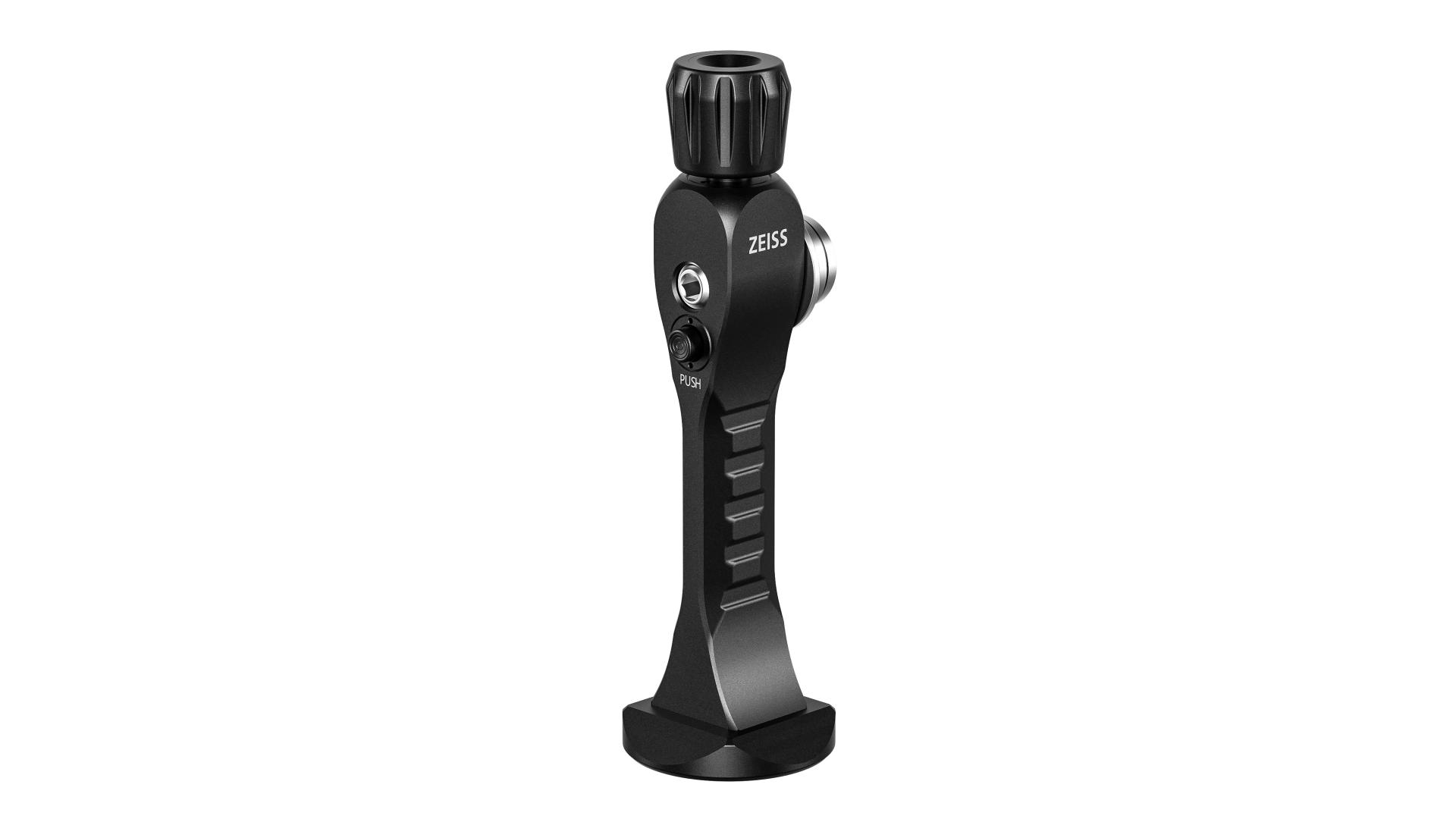 Black ZEISS-branded optical instrument accessory with ergonomic grip and adjustment knob, standing upright on a flat base.