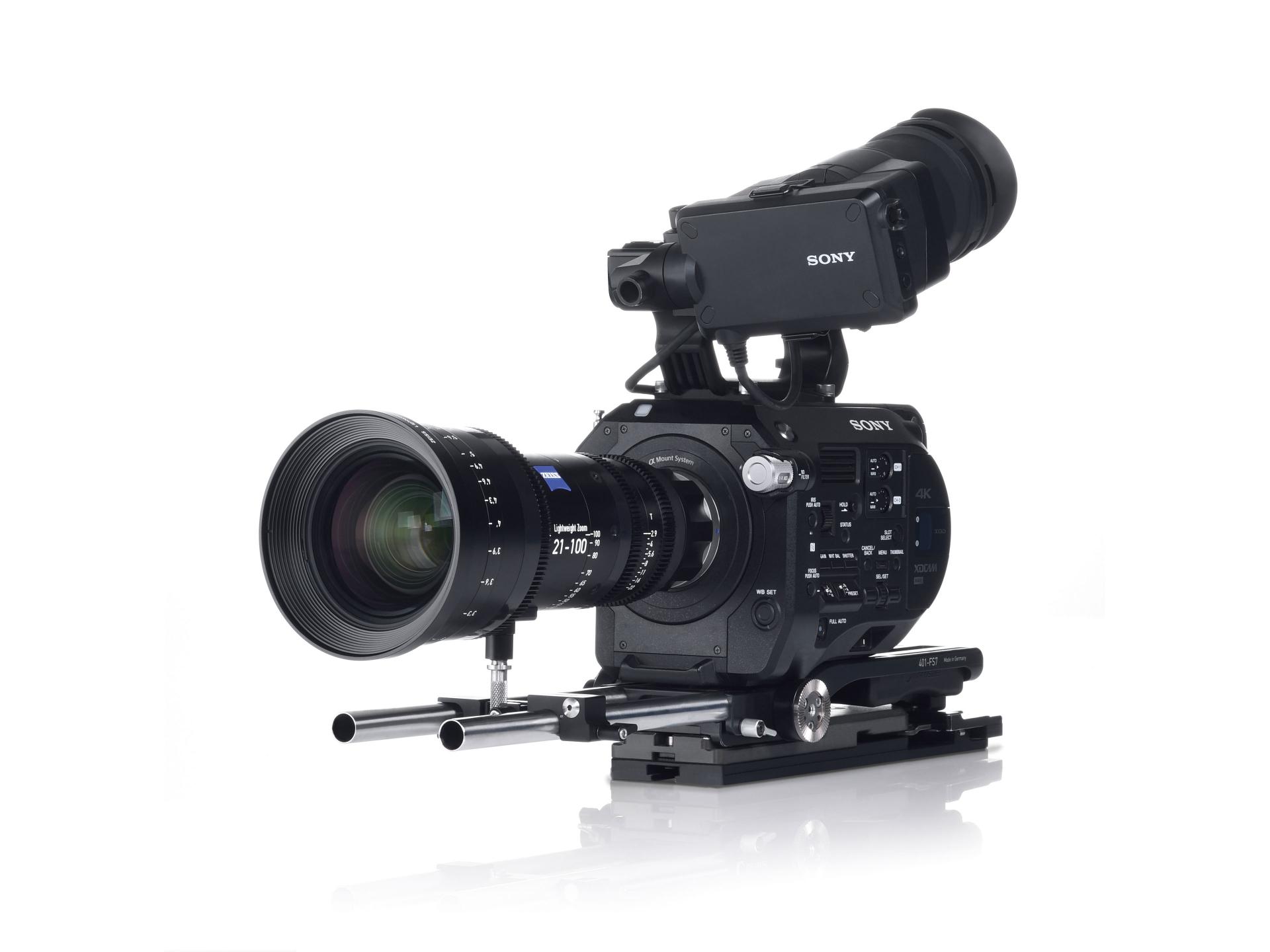 Professional video camera setup featuring a ZEISS lens mounted on a SONY cinema camera with rails and accessories.