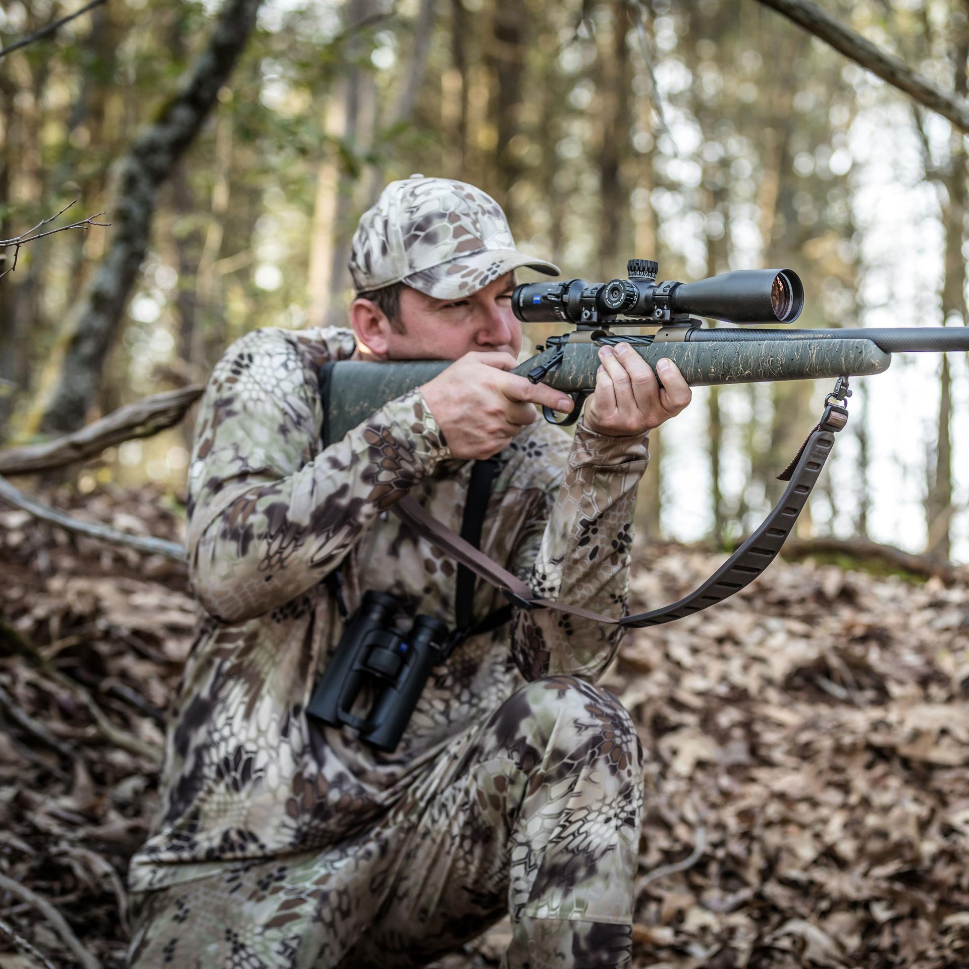 Hunter aiming his rifle fitted with a ZEISS Conquest V4 4-16x50 riflescope, ensuring reliable accuracy in any light conditions