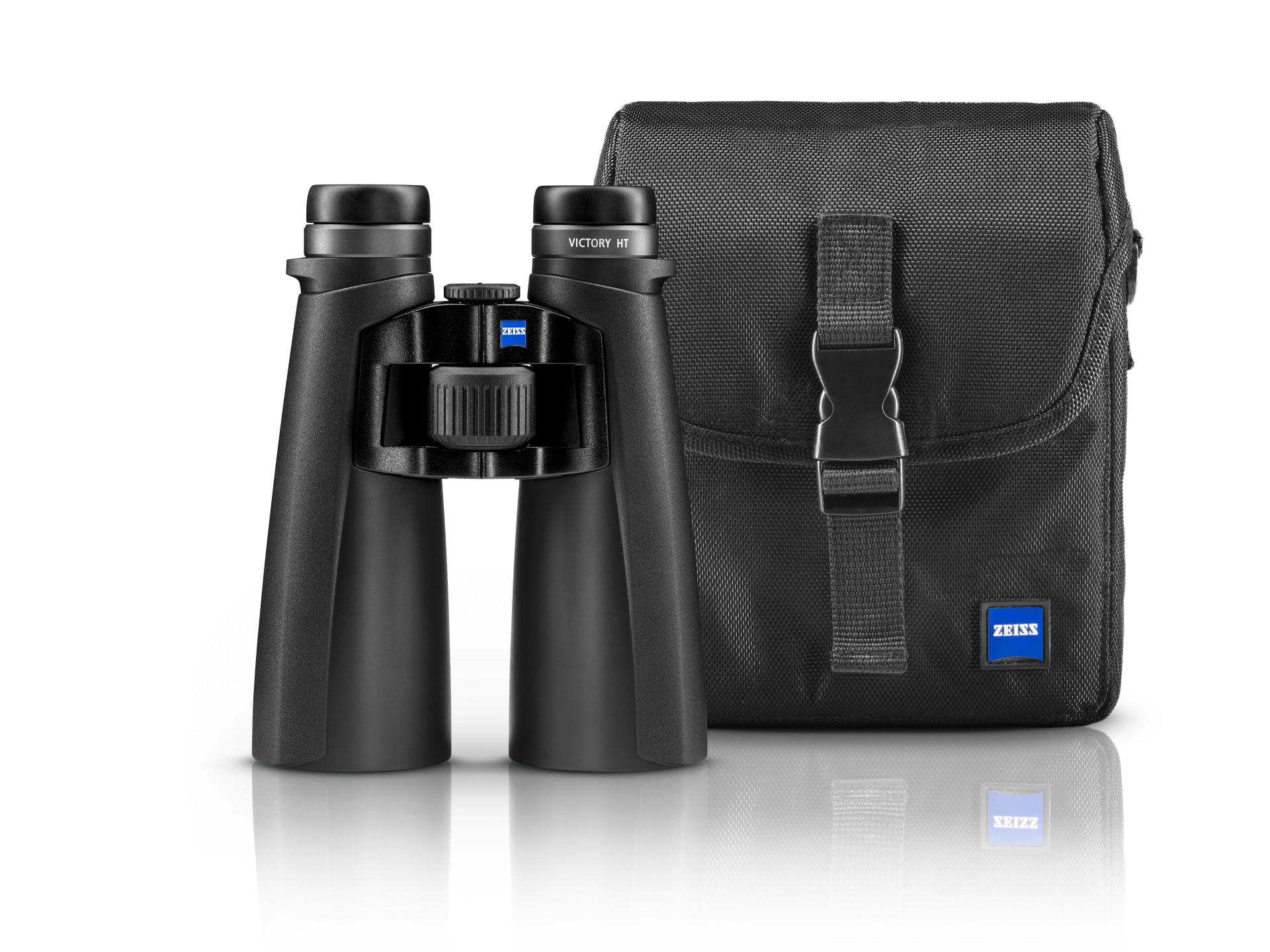 Black ZEISS Victory HT binoculars standing upright beside a matching black carrying case with the ZEISS logo.