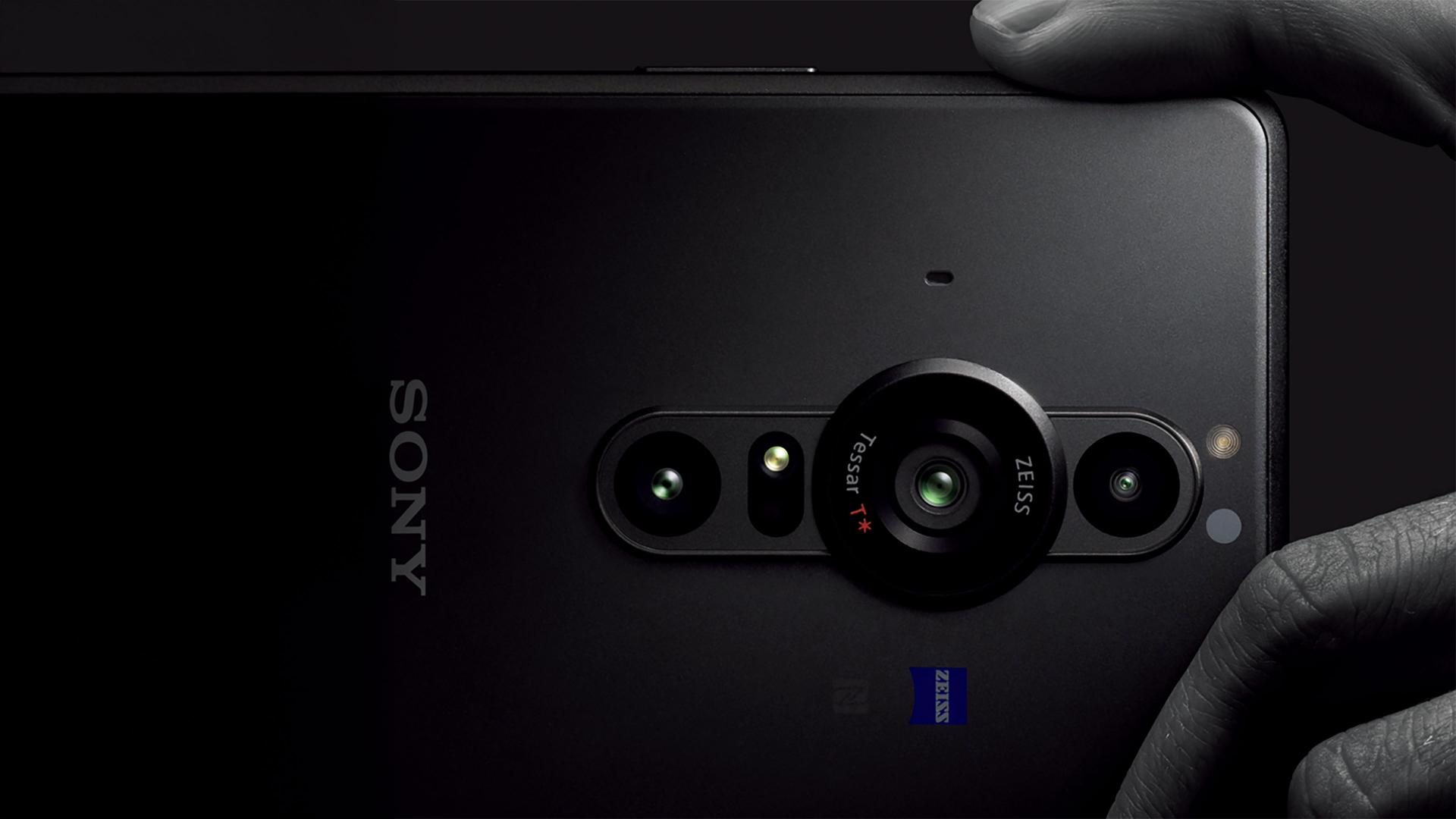 Close-up of a smartphone camera with ZEISS branding on the lens, shown alongside a full view of the front and back of the same smartphone.