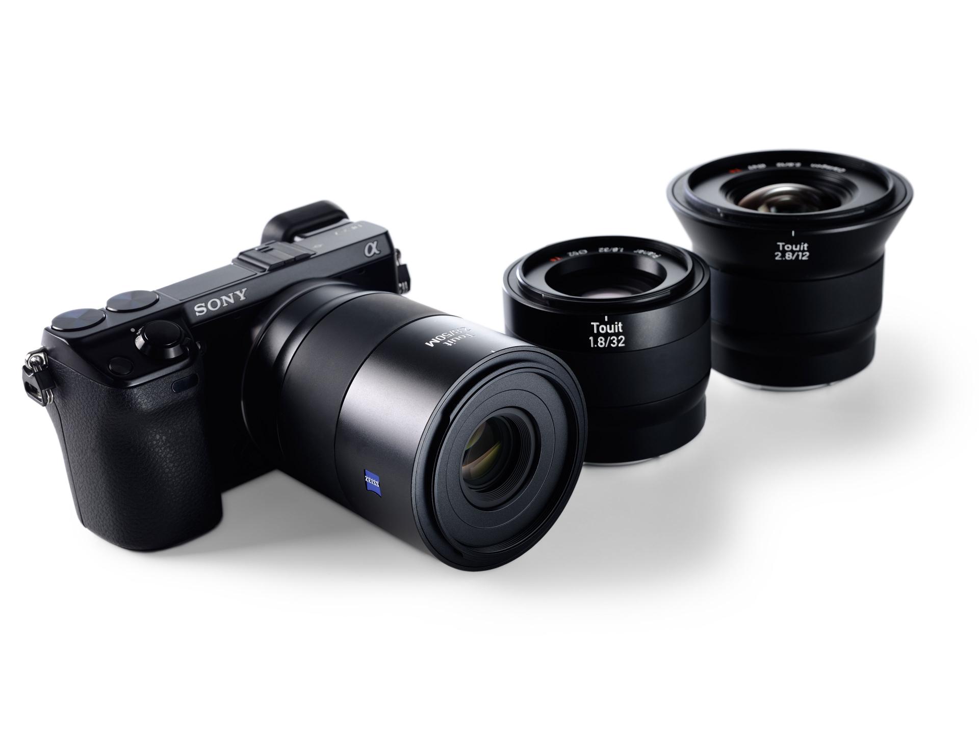 Black ZEISS Touit 1.8/32 camera lens displayed on a white background.