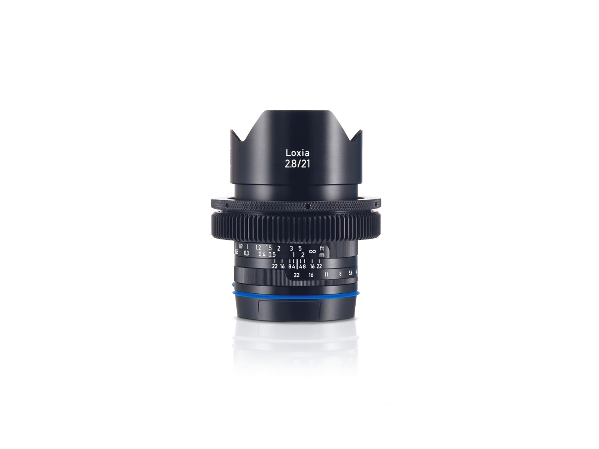 Front view of a ZEISS Loxia 2.8/21 camera lens with focus and aperture markings clearly visible.