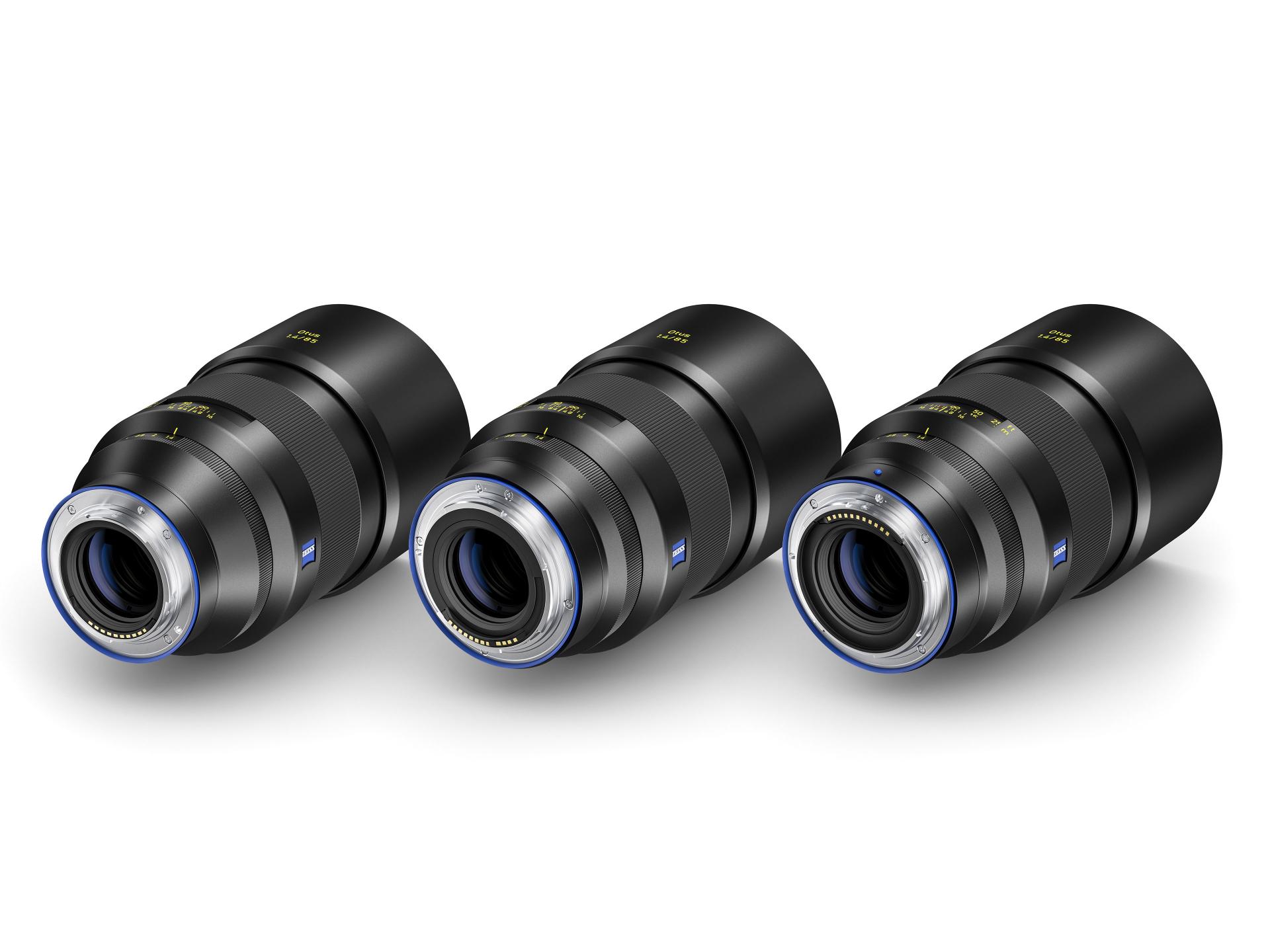 Three ZEISS camera lenses are displayed side by side on a white background, showcasing different angles of the product.