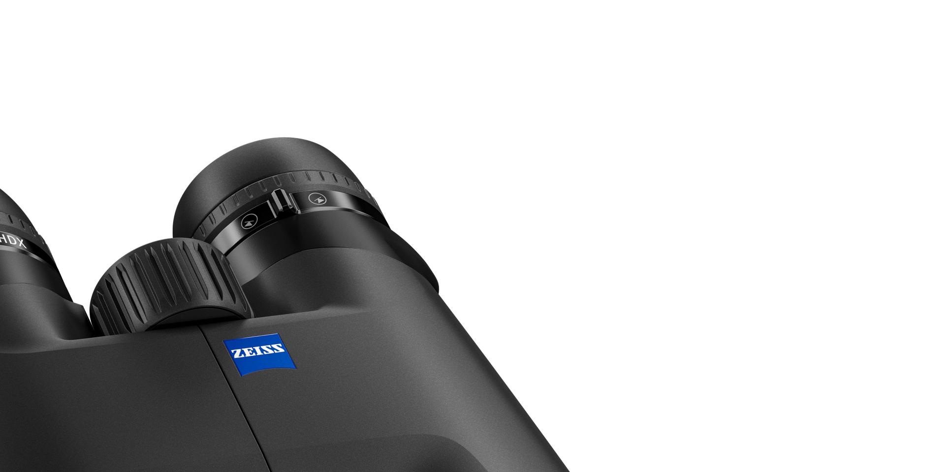 Close-up view of a pair of black ZEISS binoculars showing the focus wheel and eyepiece details.