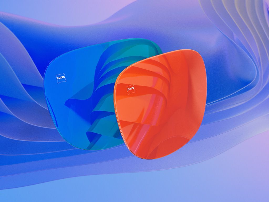 Illustrazione 3D CGI di due lenti per occhiali da sole con specchiatura blu e arancione.