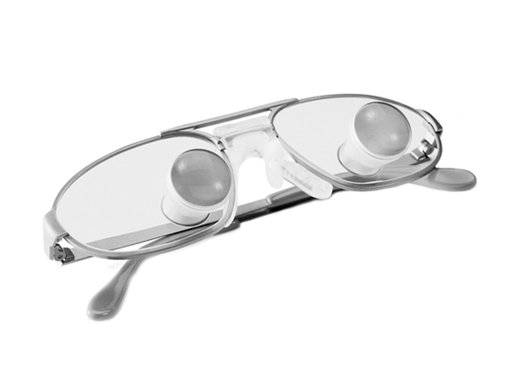 Spectacle lenses with a lace and ZEISS Teleloupe Spectacles mounted directly on the lenses.